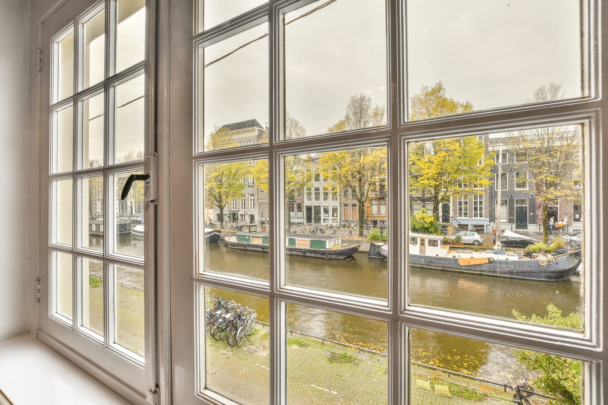 Casement uPVC window with a scenic waterside view